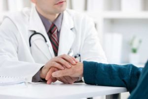 doctor and patient in doctor's office discussing better care