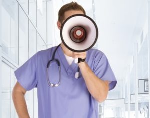 Male nurse giving a public service announcement through a megaphone