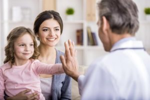 mother and child patient chatting with doctor