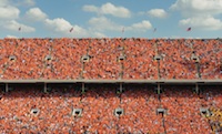 Stadium filled with people and cloudy skies