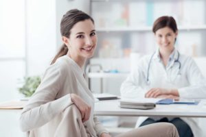 doctor and patient smiling due to maintaining patient loyalty