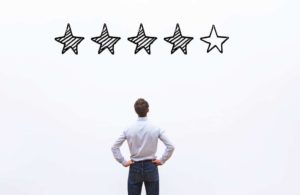 man looking up at 4 star rating