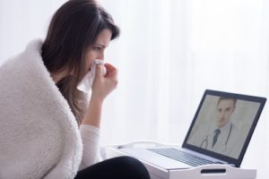 sick patient on video chat with doctor