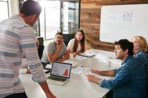 Staff having a marketing meeting in a conference room