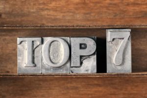 "Top 7" letter blocks on wooden table