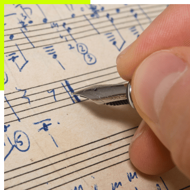 Composing music with a pen on a music sheet